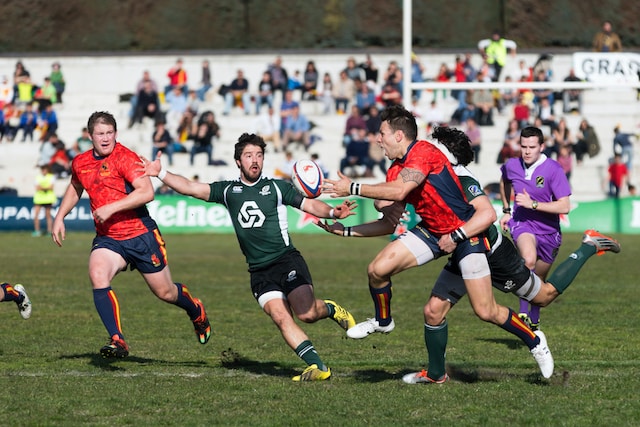 a rugby pass and tackle
